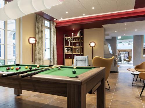 a billiard room with a pool table at Aparthotel Adagio Lille Centre Grand Place in Lille