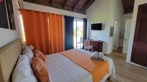 Postel nebo postele na pokoji v ubytování Hotel Sea Breeze Sosua