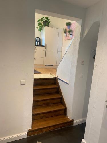 a staircase in a house with wooden steps at Auszeit Deluxe in Kirchheim unter Teck