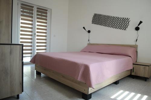 Ένα ή περισσότερα κρεβάτια σε δωμάτιο στο Villa Francesca B