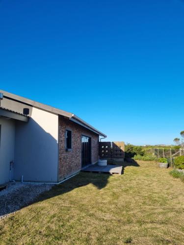 a view of a house with a yard at Heaven Scent in Bettyʼs Bay