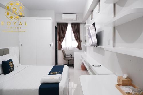 Postel nebo postele na pokoji v ubytování Royal Suites Studio 15QR - Baloi Apartment