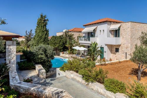 a villa with a swimming pool and a house at Villa Dafni with Private Pool in Gouves