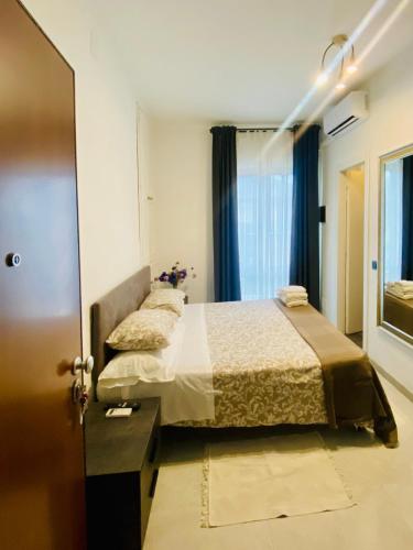 a hotel room with two beds and a door at Da Fernanda in Guidonia