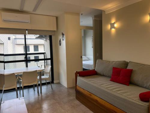 a living room with a couch and a table at Airfamily Congonhas in Sao Paulo