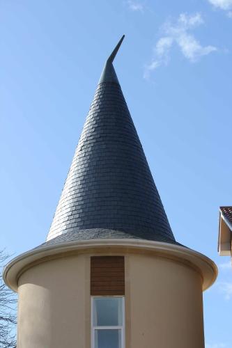 a roof on top of a building with a window at Wookey Hole Hotel in Wells