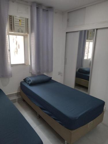 En eller flere senge i et værelse på Kitnet 203