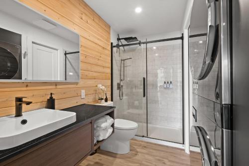 a bathroom with a sink and a shower at Nalu Retreat Lakeside Villa in Porters Lake