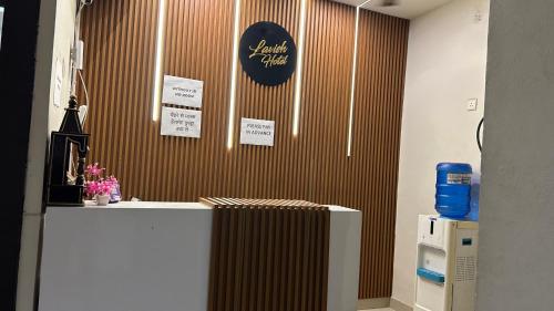 a room with a counter with a sign on the wall at Hotel Lavish Inn in Jāmb