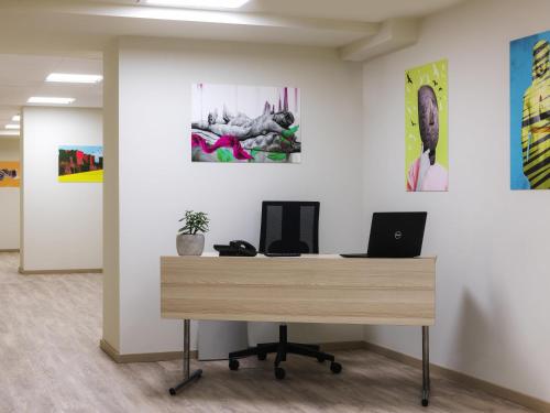 an office with a desk with a laptop on it at ibis Styles Athens Routes in Athens