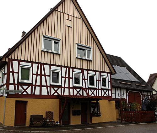 a half timbered building with white and brown at Schöne 2 Zimmer Wohnung in Sulz Bergfelden bis 4 Personen in Sulz am Neckar