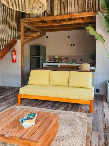 a living room with a couch and a table at Villa Mango Jeri in Jericoacoara