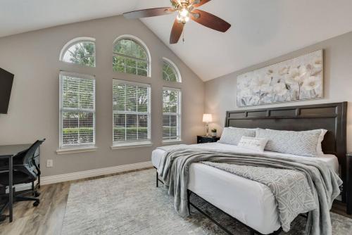 a bedroom with a bed and a ceiling fan at Updated, Comfortable, And Quiet Space! in Trinity Mills