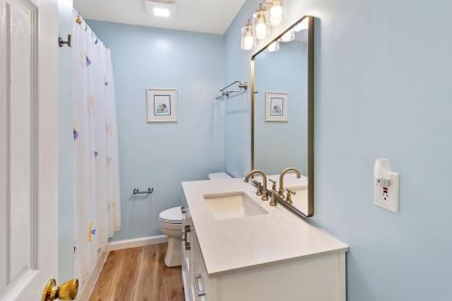 a bathroom with a sink and a toilet at PW20 - Sea View in Southern Shores
