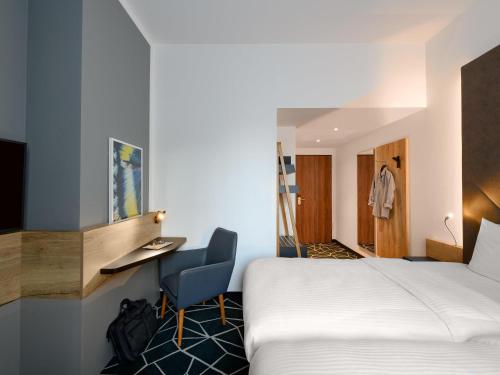Postel nebo postele na pokoji v ubytování Ibis Styles Aschaffenburg