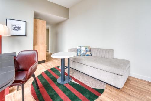 a living room with a couch and a table at Toor Hotel Toronto, Part Of Jdv By Hyatt in Toronto