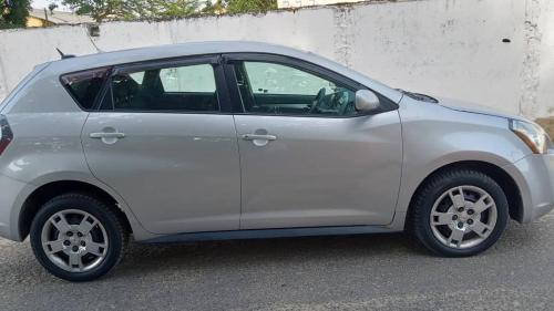 a white car parked in a parking lot at Bafoussam derrière Stade municipal Bamendzi in Bafoussam