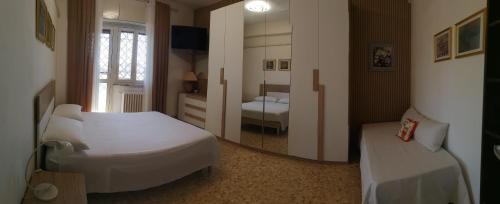 Ένα ή περισσότερα κρεβάτια σε δωμάτιο στο Il Melograno - Just like at home!