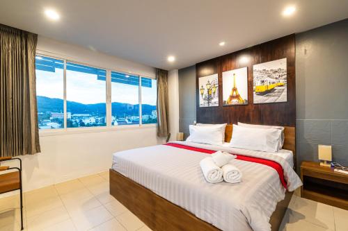 Katil atau katil-katil dalam bilik di Phuket Five For tune Holiday Hotel