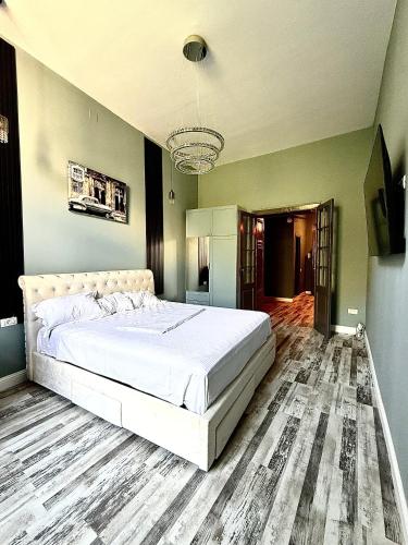 a bedroom with a large white bed in a room at Laya Old Town Blue in Bucharest