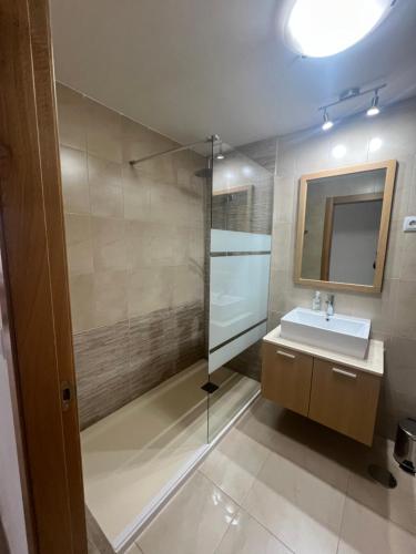 a bathroom with a sink and a shower at Apartment in Hacienda Riquelme Golf Resort in Sucina