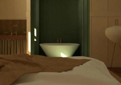 a bedroom with a white sink in a green wall at Winnedumah Hotel in Independence