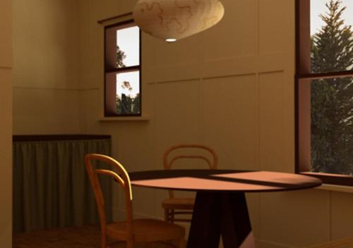 a table and chairs in a room with a window at Winnedumah Hotel in Independence