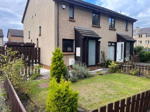 a house with a garden in front of it at Hutchison apartments in Edinburgh