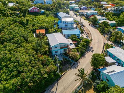 an aerial view of a town with houses and a road at Colorful Garden House in Providencia