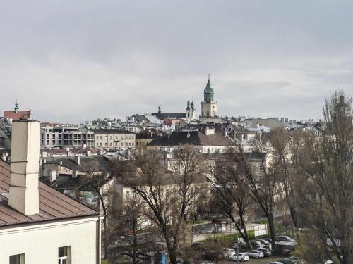 a view of a city with buildings and cars at ibis Styles Lublin Stare Miasto in Lublin