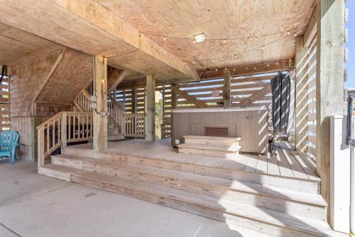 a porch of a house being constructed with wood at 8076 - Siren's Serenade in Rodanthe