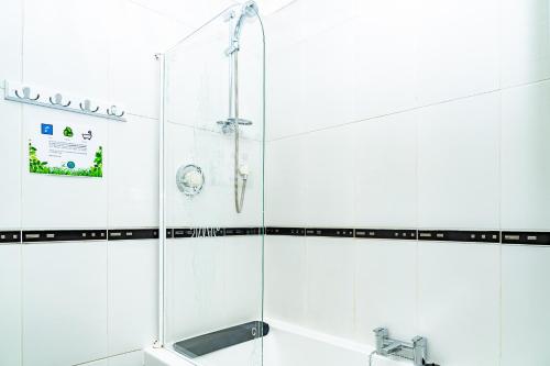 a bathroom with a shower and a sink at 2BR Hotel-Style Near Beach, Free Parking, Sleeps 4 in Edinburgh