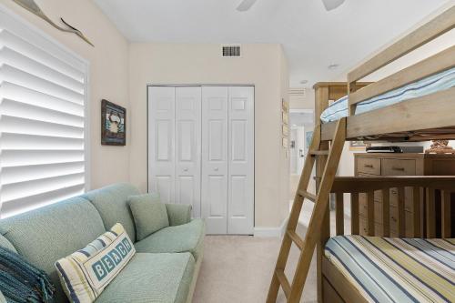 a living room with a couch and a bunk bed at Atlantic Villas 102 in Chicken Island