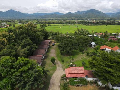 an aerial view of a village with a train in a field at นะลาวิว รีสอร์ท ปัว Nala View Resort Pua in Pua