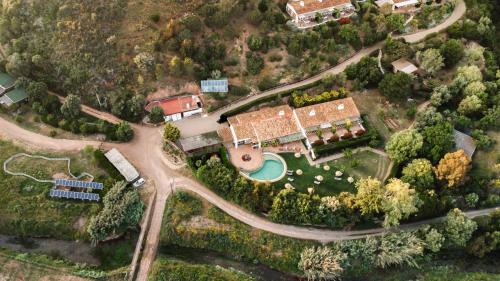 an aerial view of a house with a road at Monte Da Vilarinha in Carrapateira