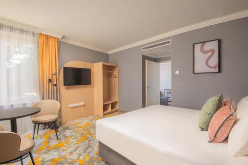 TV a/nebo společenská místnost v ubytování Castrum Hotel Székesfehérvár