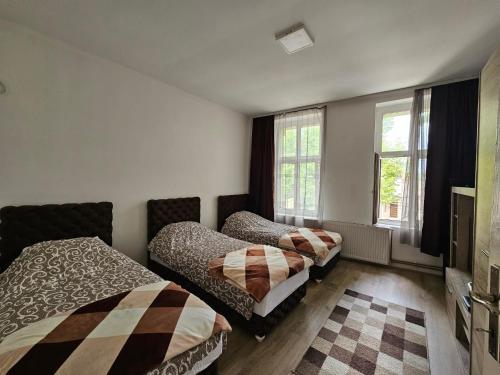 Ένα ή περισσότερα κρεβάτια σε δωμάτιο στο Apartman Knez 64