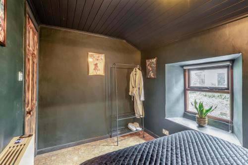 a bedroom with a bed and a window and a shower at 2 Bed in Ravenstonedale oc-t33208 in Ravenstonedale