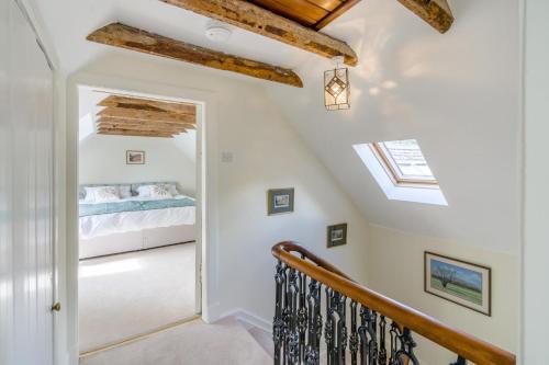 a staircase leading to a bedroom with a bed at 3 Bed in Comrie oc-e33307 in Dunira