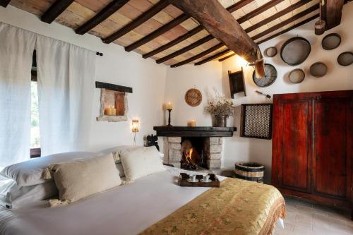 Ένα ή περισσότερα κρεβάτια σε δωμάτιο στο ROMITO - Relais & Spa