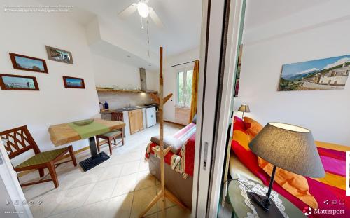 a room with a kitchen and a dining room at Ai Cinque Campanili in Finale Ligure