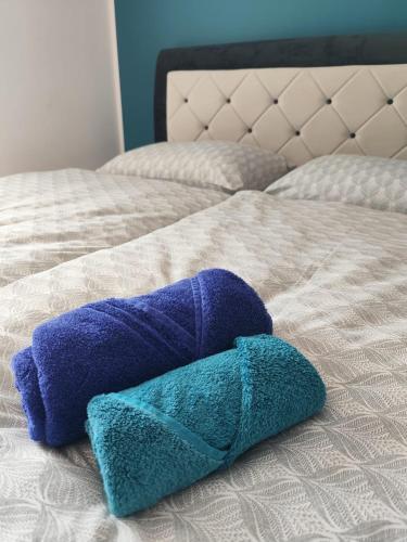 two towels sitting on top of a bed at Bella Vista Ferienwohnung in Bürs