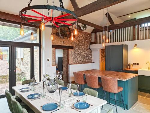 a dining room with a table and chairs in a kitchen at 3 Bed in Dulverton oc-t32975 in Dulverton