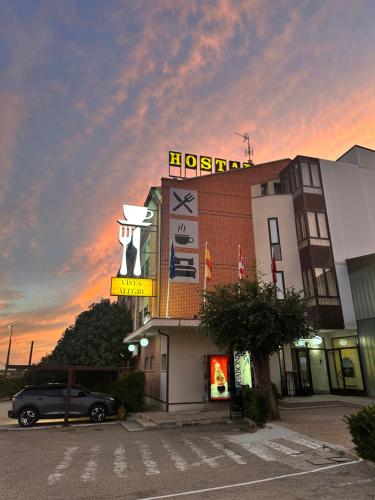 a hotel with a sign on top of a building at H Vista Alegre in Geria