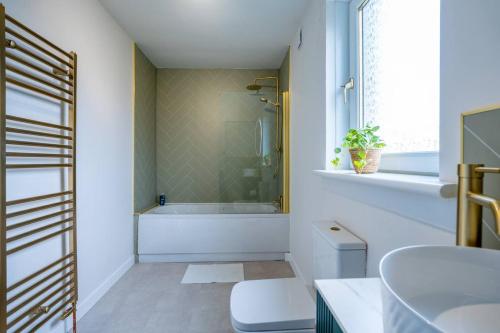 a bathroom with a shower and a sink at Luxury 3 bedroom apartment in Stonehaven