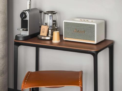 a table with a microwave and a radio on it at Novotel Paris Porte Versailles in Paris
