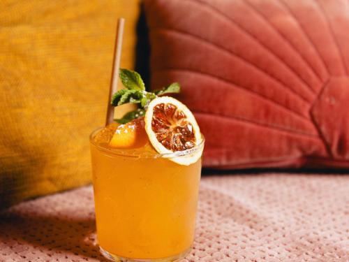 a drink with a orange slice on a table at Novotel Paris Porte Versailles in Paris