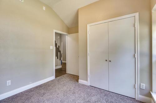 a hallway with a white closet in a house at Tailgate Fun and Campus Spirit Bryan Home with Patio in Bryan