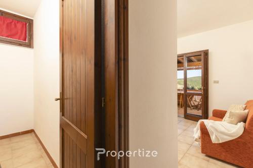 a room with a door leading to a living room at Il terrazzo sulla duna 4 Torre dei Corsari in Torre Dei Corsari