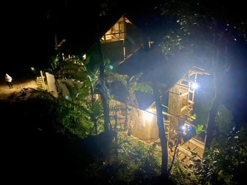 ein Haus in der Nacht mit Lichtern davor in der Unterkunft UNDE Village Camp Morogoro in Morogoro